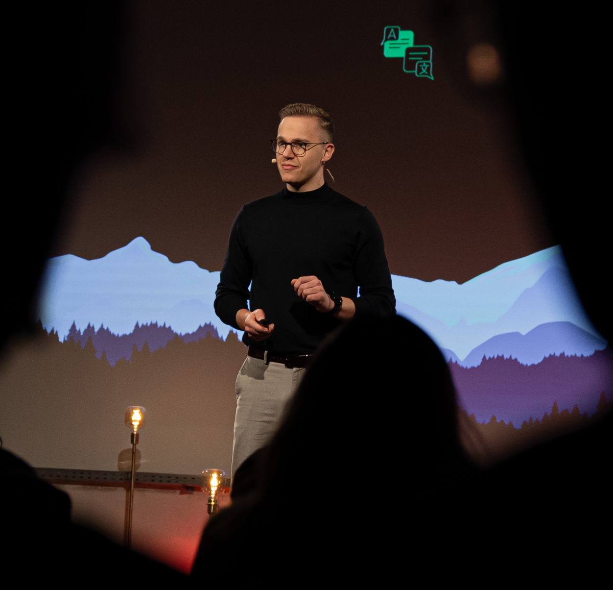Dr. Moosbrugger speaking on stage